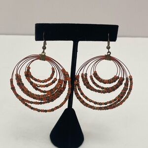 Coral and copper bead multi strand round drop earrings.
